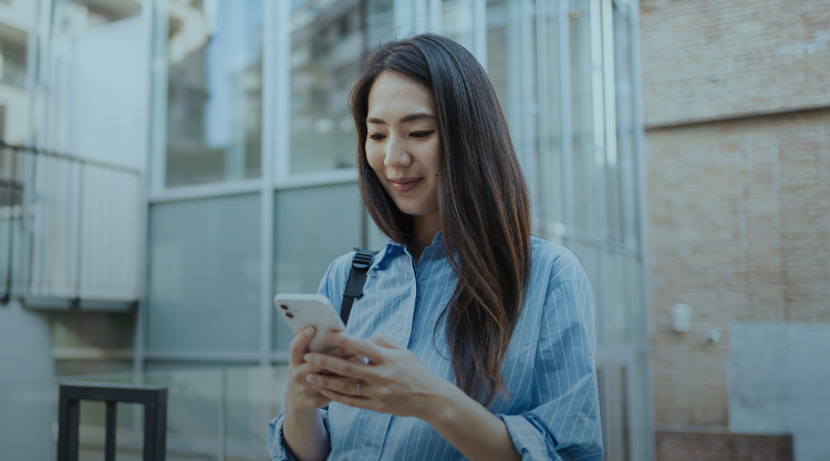 A woman uses her mobile device